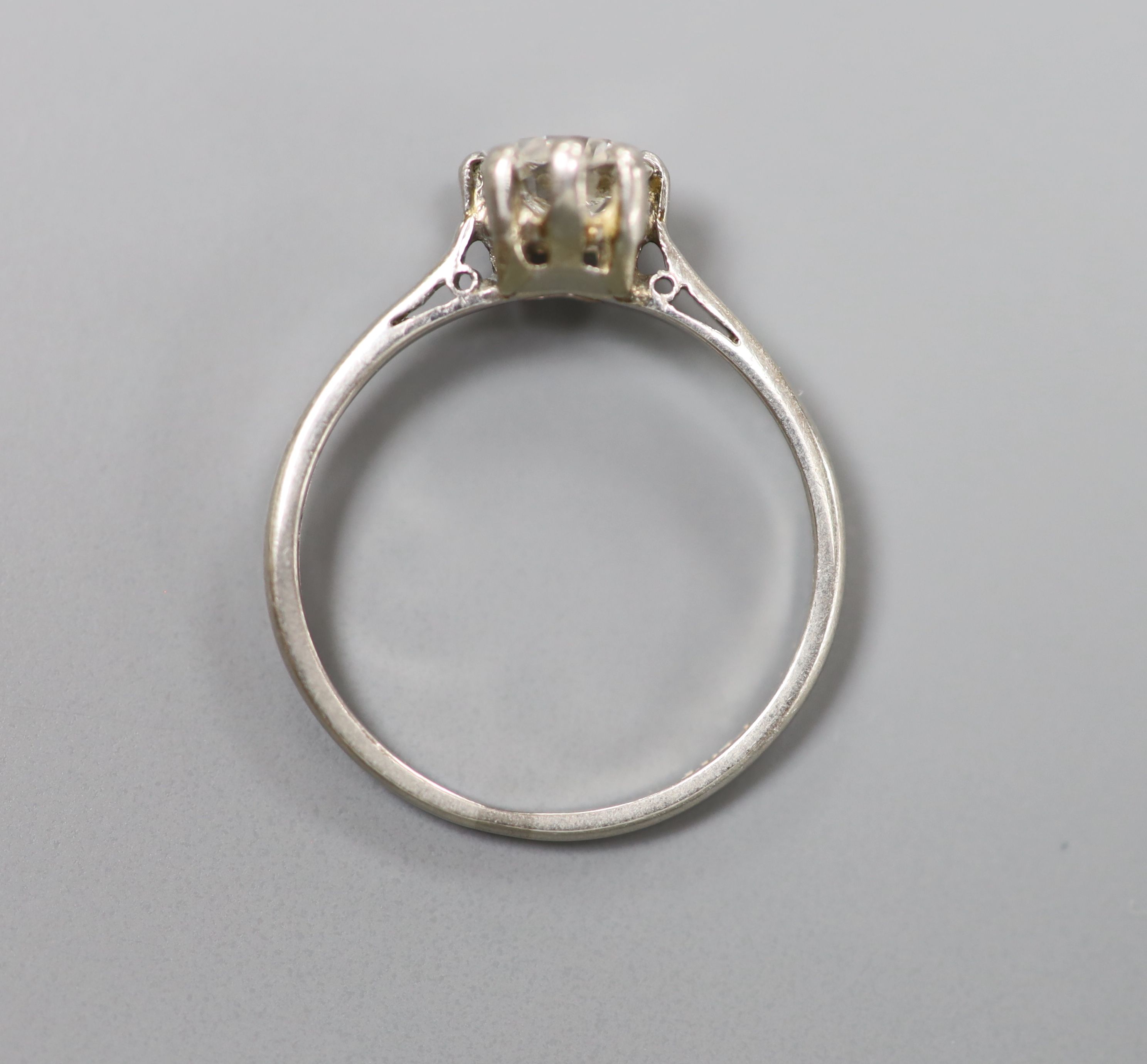 A white metal (stamped plat) and solitaire diamond ring